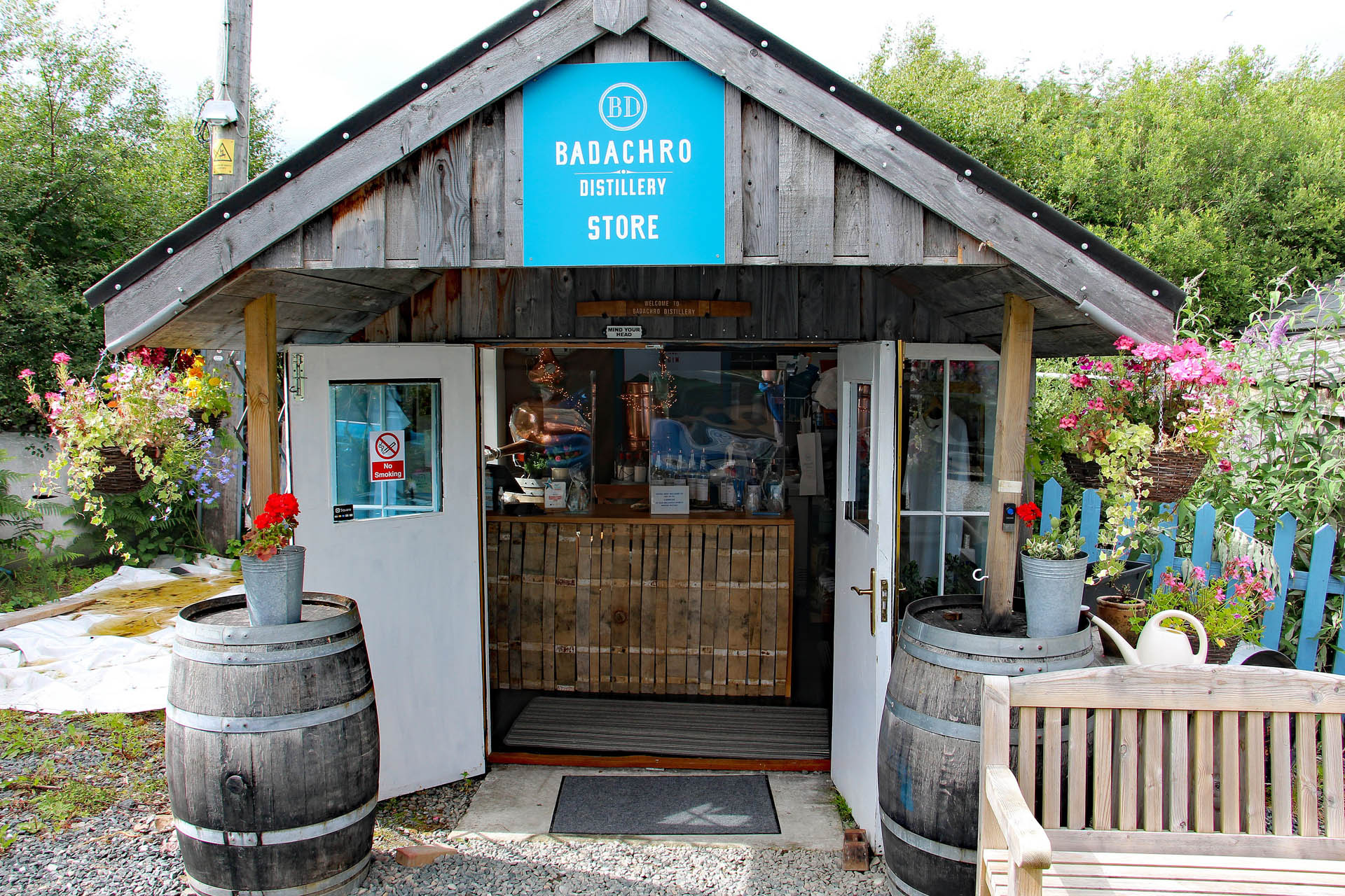 A picture of the outside of the Badachro Distillery shop in Gairloch.